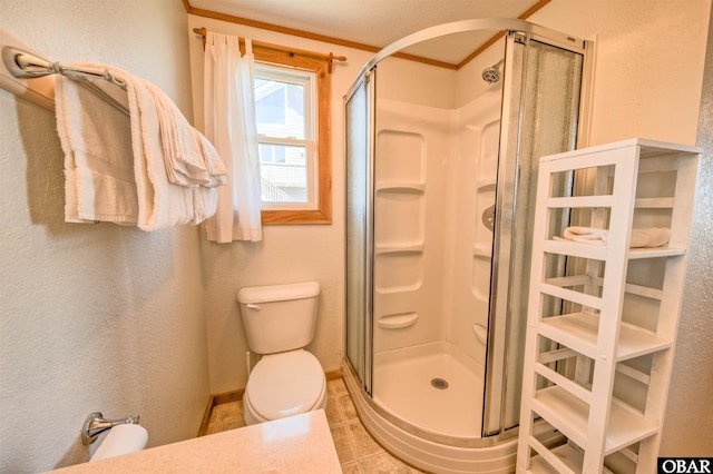 42075 Ocean View Dr Lot 3, Avon, NC 27943 - full bathroom featuring toilet, a shower stall, tile patterned floors, baseboards, and a textured wall