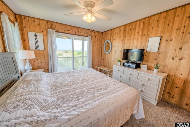42075 Ocean View Dr Lot 3, Avon, NC 27943 - bedroom featuring access to outside, wood walls, light colored carpet, and a ceiling fan