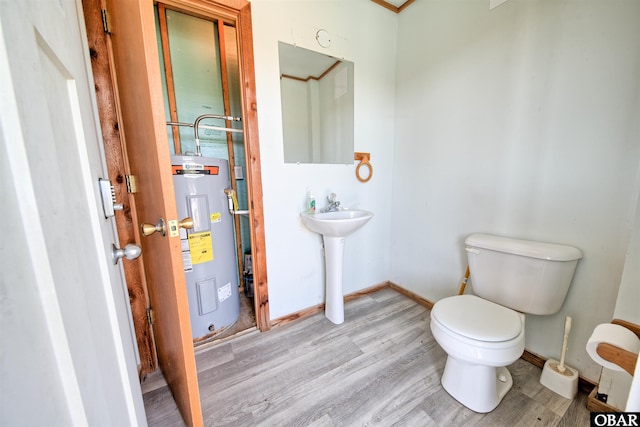 42075 Ocean View Dr Lot 3, Avon, NC 27943 - bathroom featuring water heater, wood finished floors, toilet, and baseboards