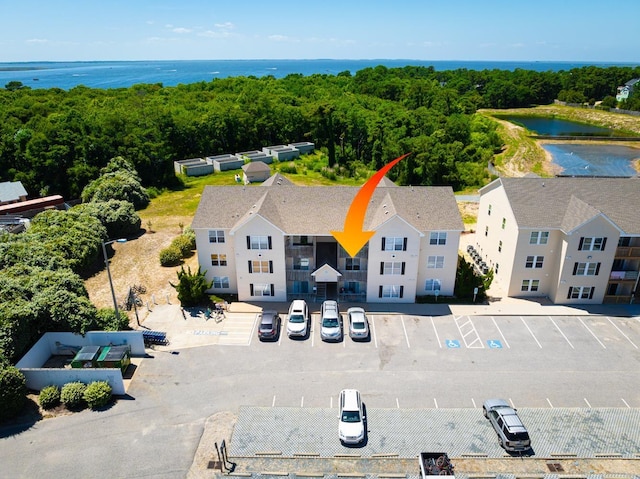 birds eye view of property featuring a water view