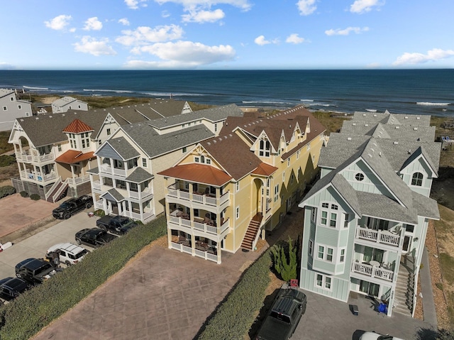 drone / aerial view featuring a water view and a residential view