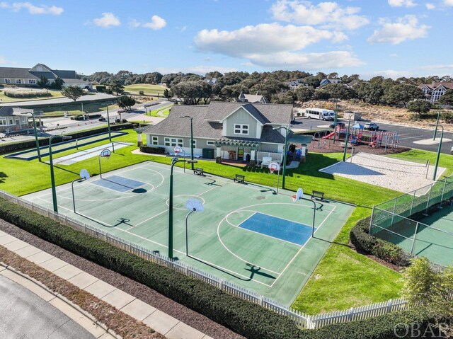 view of sport court with community basketball court, a pergola, fence, and playground community