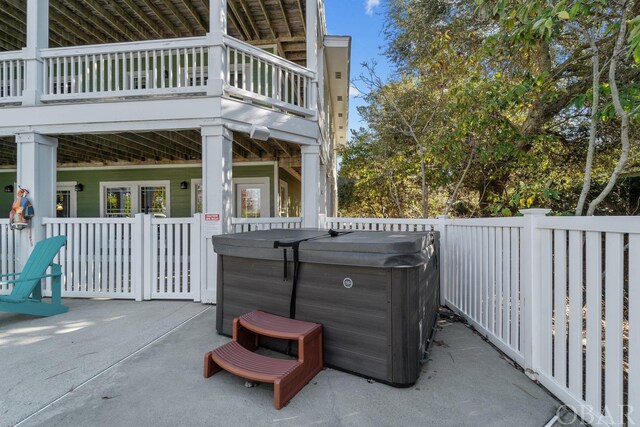 view of patio / terrace with a hot tub