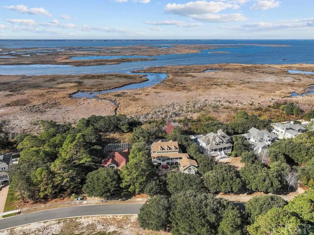 birds eye view of property with a residential view and a water view