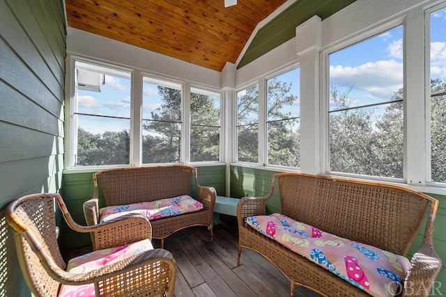 sunroom / solarium featuring lofted ceiling and wooden ceiling