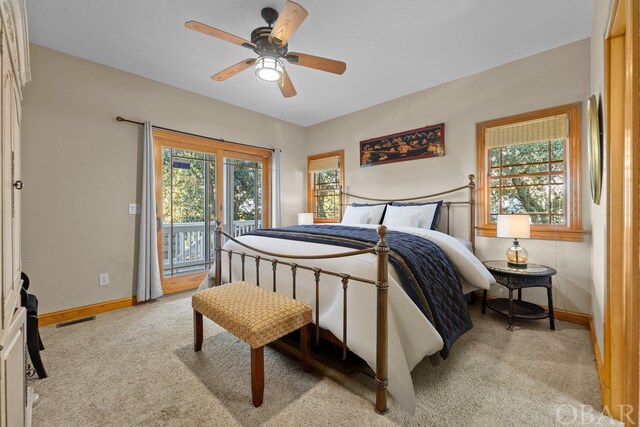 bedroom featuring baseboards, access to outside, visible vents, and light colored carpet