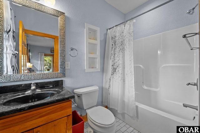 bathroom featuring shower / tub combo, tile patterned flooring, vanity, and toilet