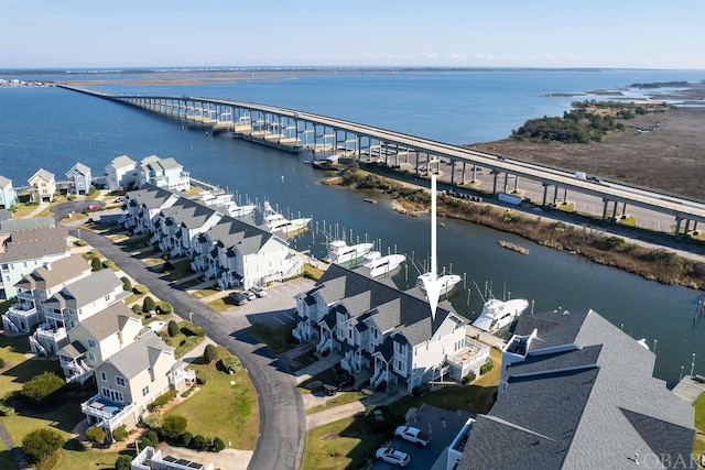 drone / aerial view featuring a water view and a residential view