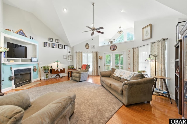 102 Lighthouse Vw Lot 5, Aydlett, NC 27916 - living area with a fireplace with flush hearth, high vaulted ceiling, ceiling fan, and wood finished floors