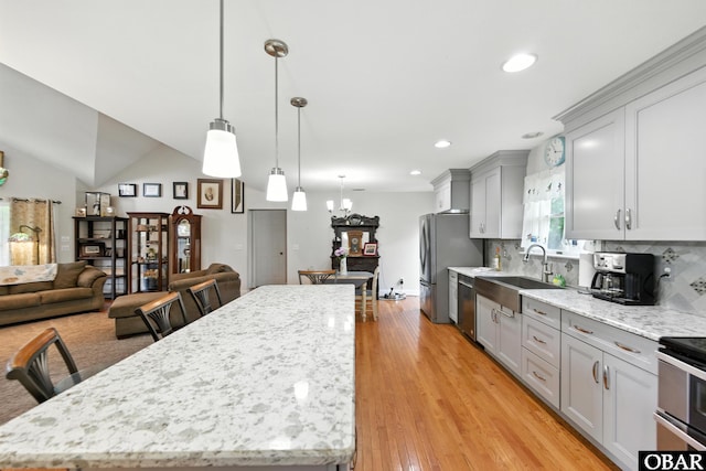 102 Lighthouse Vw Lot 5, Aydlett, NC 27916 - kitchen featuring stainless steel appliances, gray cabinetry, a kitchen island, light stone countertops, and open floor plan