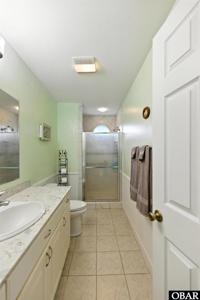 102 Lighthouse Vw Lot 5, Aydlett, NC 27916 - full bath featuring vanity, tiled shower, tile patterned floors, a textured ceiling, and a wainscoted wall