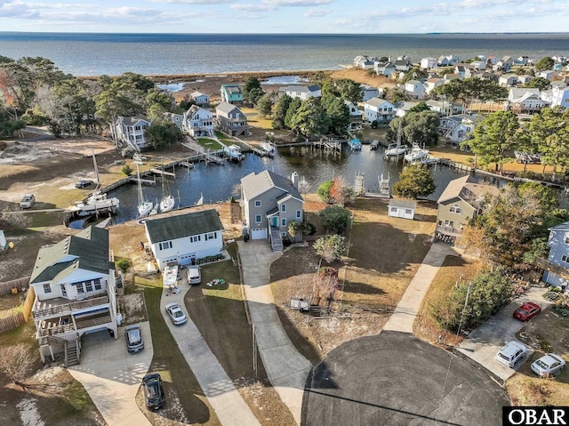 aerial view featuring a water view and a residential view