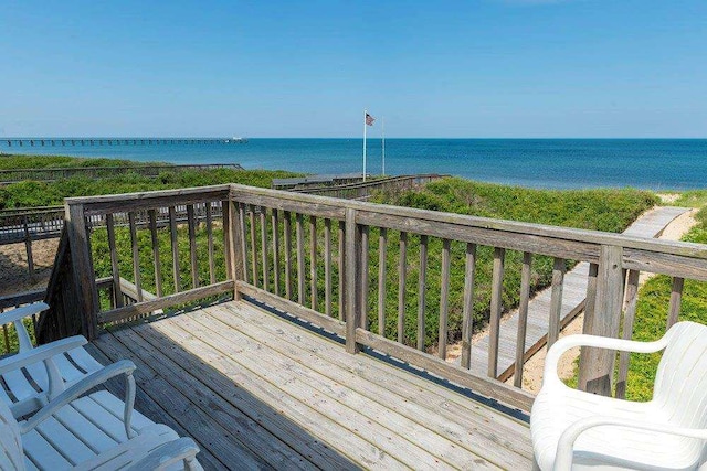 wooden deck featuring a water view