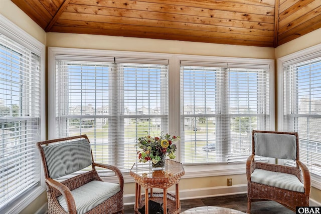 sunroom with a wealth of natural light and vaulted ceiling