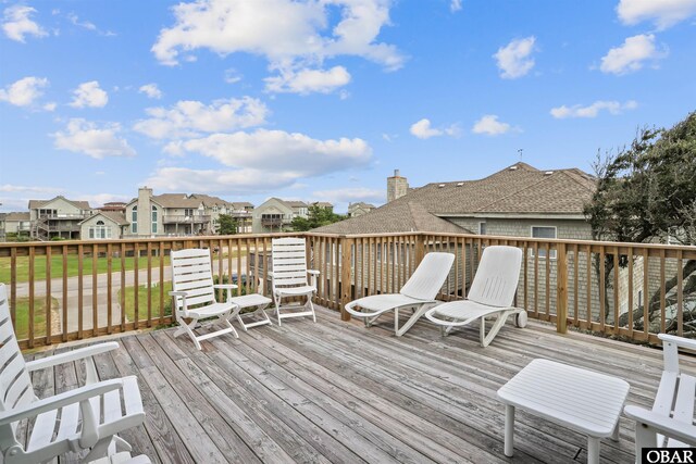 wooden terrace with a residential view