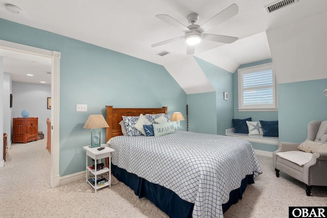 bedroom with visible vents, vaulted ceiling, light carpet, and baseboards