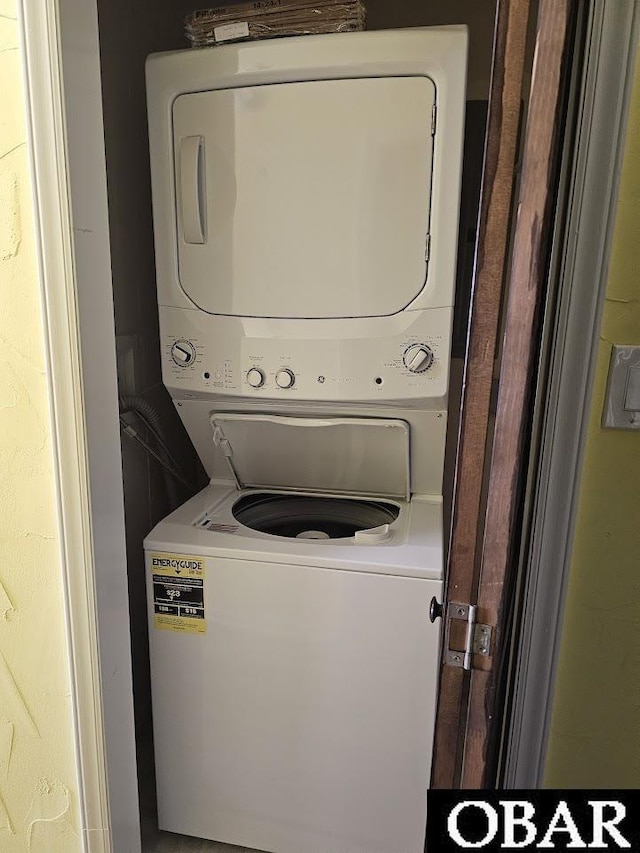 2035 S Virginia Dare Trl Unit 11, Kill Devil Hills, NC 27948 - washroom featuring estacked washer and dryer