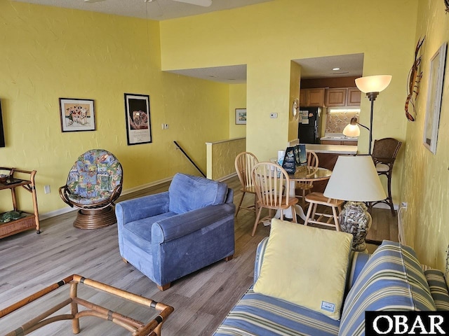 2035 S Virginia Dare Trl Unit 11, Kill Devil Hills, NC 27948 - living area featuring wood finished floors, ceiling fan, and baseboards