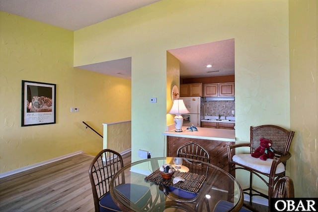 2035 S Virginia Dare Trl Unit 11, Kill Devil Hills, NC 27948 - dining space with wood finished floors and baseboards