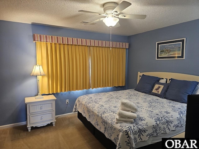 2035 S Virginia Dare Trl Unit 11, Kill Devil Hills, NC 27948 - bedroom with carpet flooring, baseboards, a textured ceiling, and ceiling fan