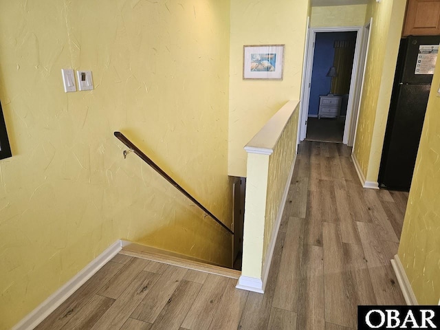 2035 S Virginia Dare Trl Unit 11, Kill Devil Hills, NC 27948 - corridor featuring wood finished floors, an upstairs landing, and baseboards