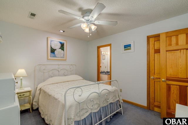 bedroom with a ceiling fan, baseboards, visible vents, a textured ceiling, and carpet flooring