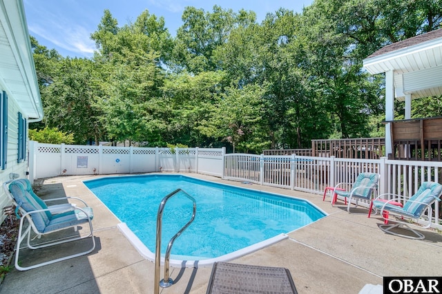 view of pool with a fenced in pool, a patio, and a fenced backyard