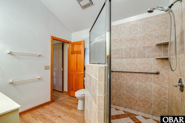 full bath featuring visible vents, toilet, a stall shower, wood finished floors, and vanity