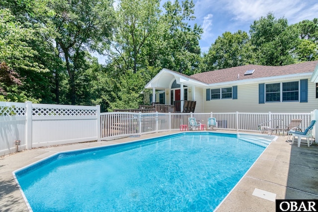 view of swimming pool featuring fence and a fenced in pool