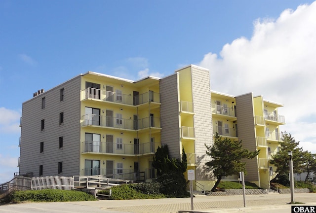 6317 S Virginia Dare Trl Unit 101, Nags Head, NC 27959 - view of apartment building / complex with fence