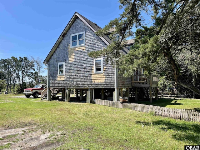 108 Loop Rd, Ocracoke, NC 27960 - view of property exterior featuring stairway and a wooden deck