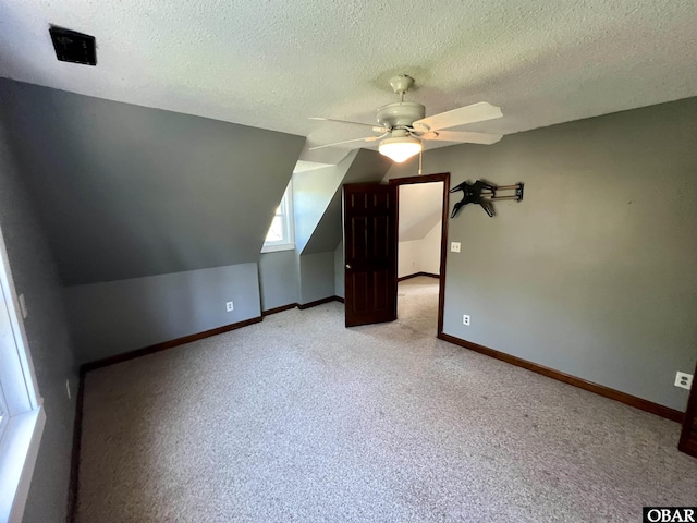 108 Loop Rd, Ocracoke, NC 27960 - bonus room with a ceiling fan, carpet flooring, a textured ceiling, and baseboards