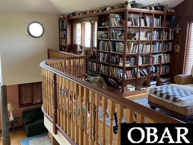 106 Middle Rd Lot 11, 12, Ocracoke, NC 27960 - living area featuring wood finished floors and an upstairs landing