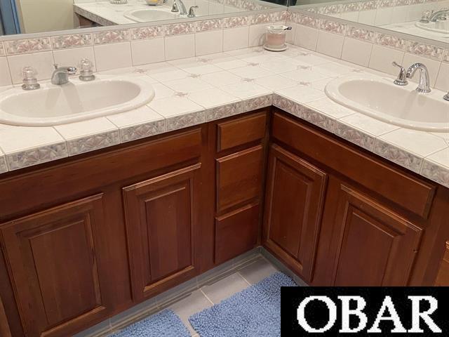 106 Middle Rd Lot 11, 12, Ocracoke, NC 27960 - bathroom featuring double vanity and tile patterned flooring