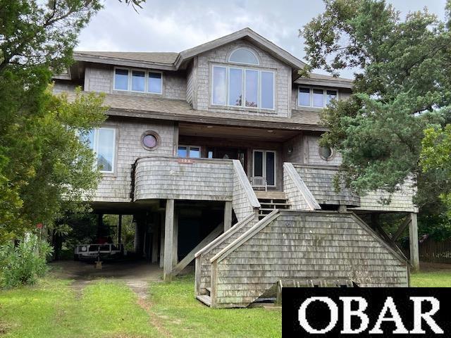 view of front of property with stairway and a porch