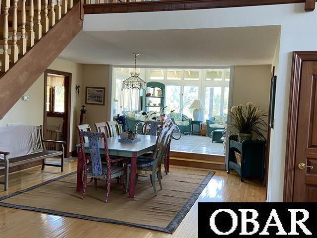 106 Middle Rd Lot 11, 12, Ocracoke, NC 27960 - dining space featuring light wood-type flooring and a chandelier