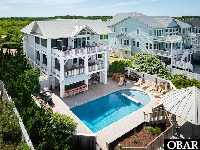 367 Lindsey Ln Lot 1, Corolla, NC 27927 - view of swimming pool featuring fence, a fenced in pool, a patio, and a bar