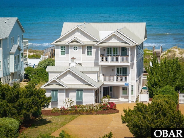 367 Lindsey Ln Lot 1, Corolla, NC 27927 - view of front facade with a water view, a standing seam roof, metal roof, and a balcony