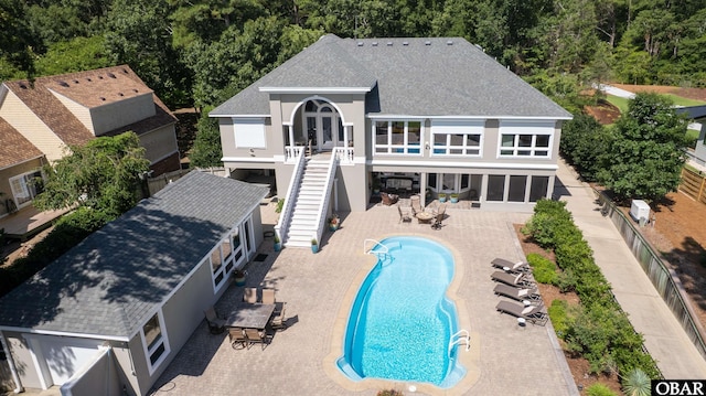 2001 Creek Rd Lot 16, Kitty Hawk, NC 27949 - rear view of house with stairs, a shingled roof, a patio, stucco siding, and a balcony
