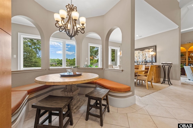 2001 Creek Rd Lot 16, Kitty Hawk, NC 27949 - dining space with light tile patterned floors, breakfast area, a towering ceiling, a chandelier, and arched walkways