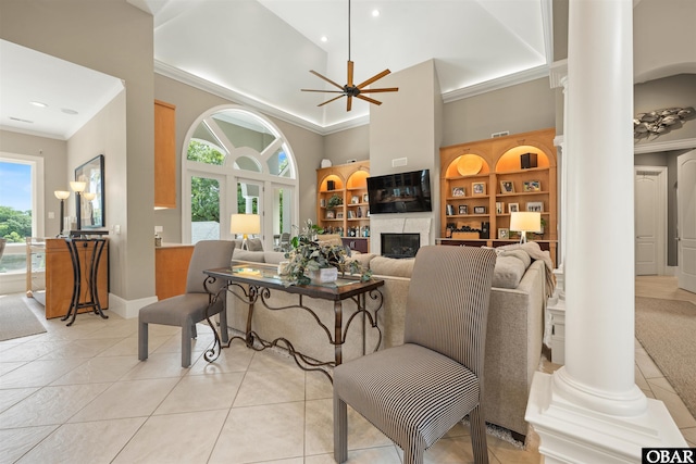 2001 Creek Rd Lot 16, Kitty Hawk, NC 27949 - living room featuring decorative columns, ornamental molding, a towering ceiling, light tile patterned floors, and a ceiling fan