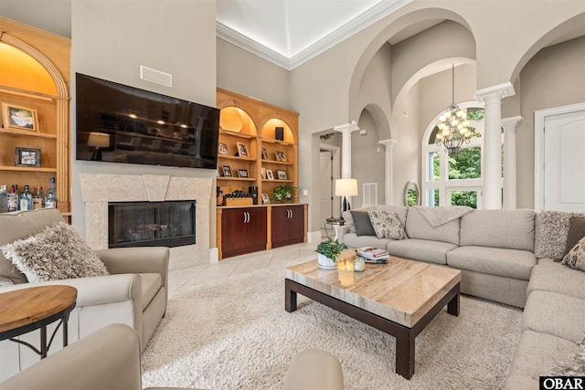 2001 Creek Rd Lot 16, Kitty Hawk, NC 27949 - living area featuring ornate columns, built in features, a towering ceiling, light tile patterned floors, and a premium fireplace