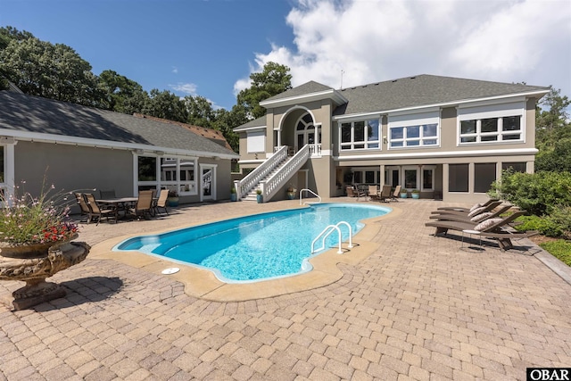 2001 Creek Rd Lot 16, Kitty Hawk, NC 27949 - outdoor pool with stairs, outdoor dining space, and a patio area
