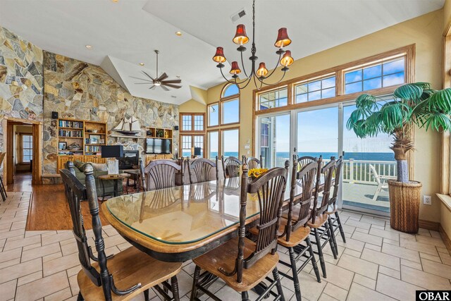369 Deep Neck Rd Lot # 139, Corolla, NC 27927 - dining room featuring a ceiling fan, a chandelier, french doors, high vaulted ceiling, and light stone finish floors
