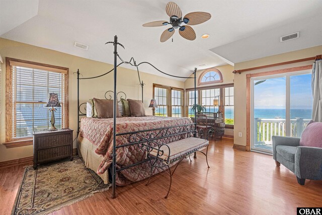 369 Deep Neck Rd Lot # 139, Corolla, NC 27927 - bedroom with vaulted ceiling, access to exterior, wood finished floors, and a water view