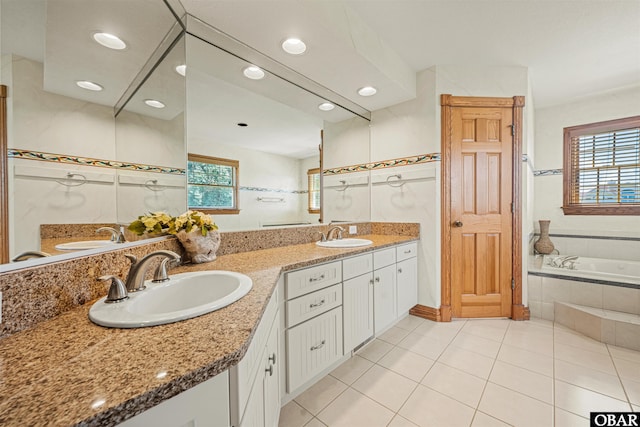 369 Deep Neck Rd Lot # 139, Corolla, NC 27927 - bathroom featuring double vanity, a garden tub, tile patterned floors, and recessed lighting