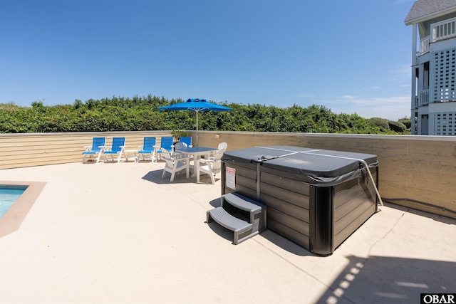 369 Deep Neck Rd Lot # 139, Corolla, NC 27927 - view of patio / terrace featuring a hot tub and outdoor dining space