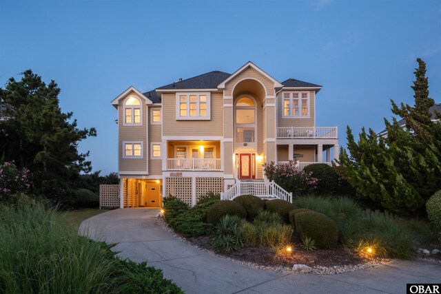 369 Deep Neck Rd Lot # 139, Corolla, NC 27927 - raised beach house featuring concrete driveway, covered porch, and stairs
