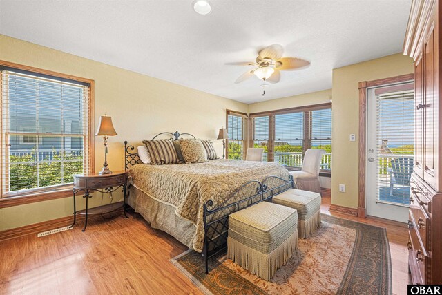 369 Deep Neck Rd Lot # 139, Corolla, NC 27927 - bedroom featuring access to outside, light wood-style flooring, and a ceiling fan