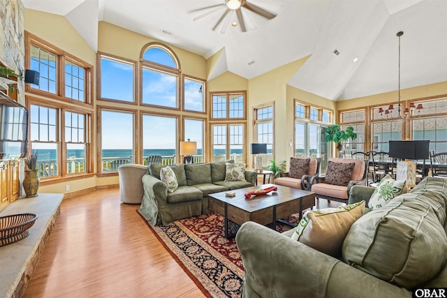 369 Deep Neck Rd Lot # 139, Corolla, NC 27927 - living room with a ceiling fan, light wood finished floors, a water view, high vaulted ceiling, and recessed lighting